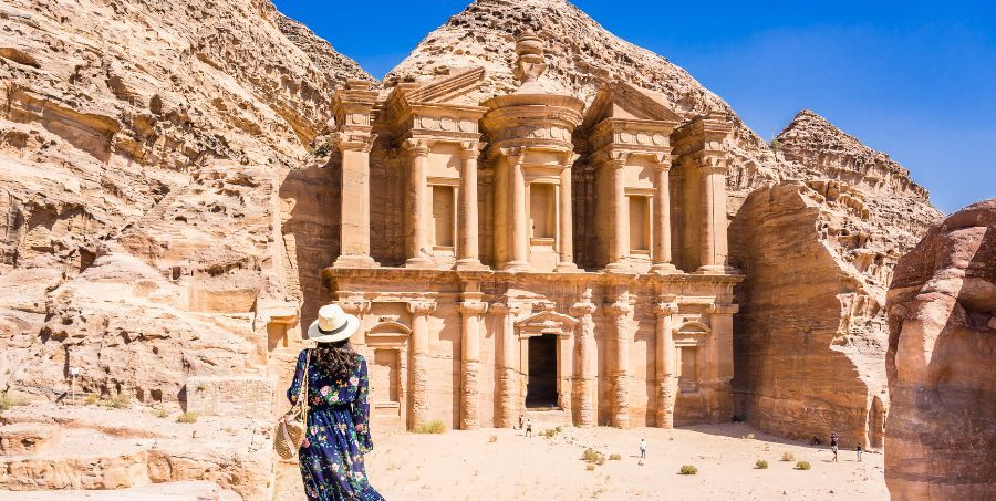 woman-exploring-monastery-petra-jordan.jpg