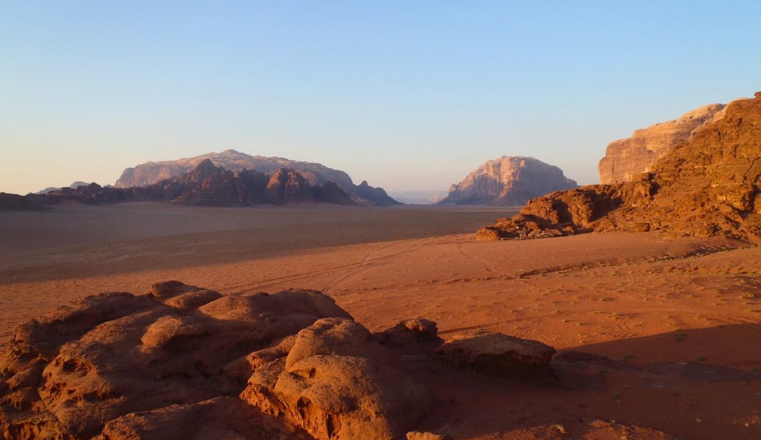 Watch the sun set over the desert of Wadi Rum.